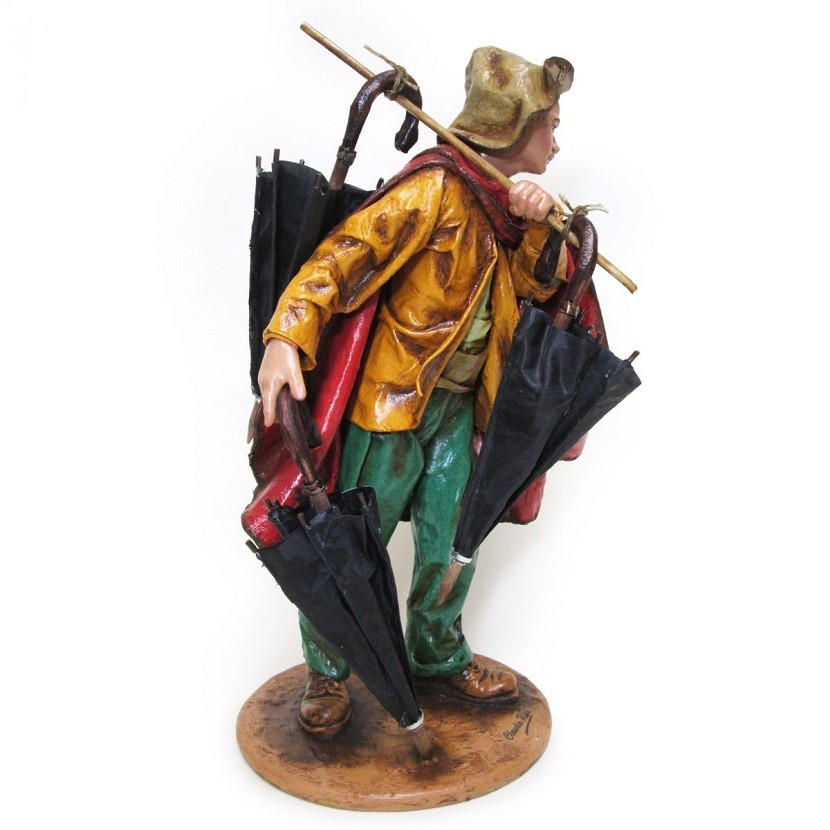 Man with umbrellas